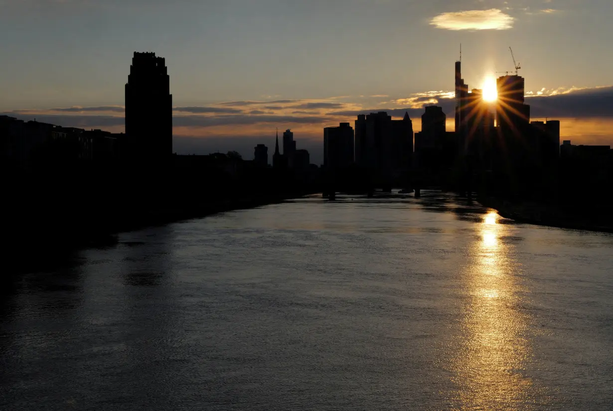 FILE PHOTO: The skyline of the banking district is seen during sunset in Frankfurt