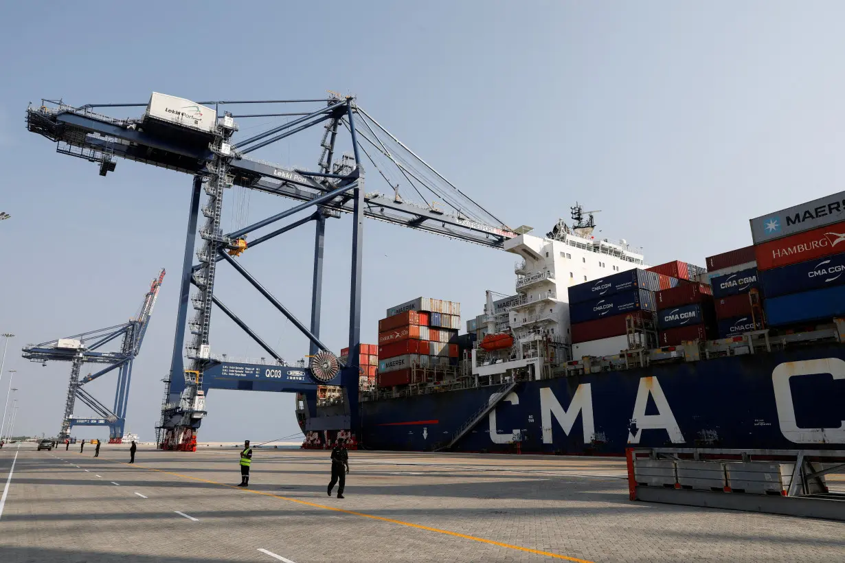 FILE PHOTO: A view shows cranes and a container ship at the newly-commissioned Lekki Deep Sea Port in Lagos