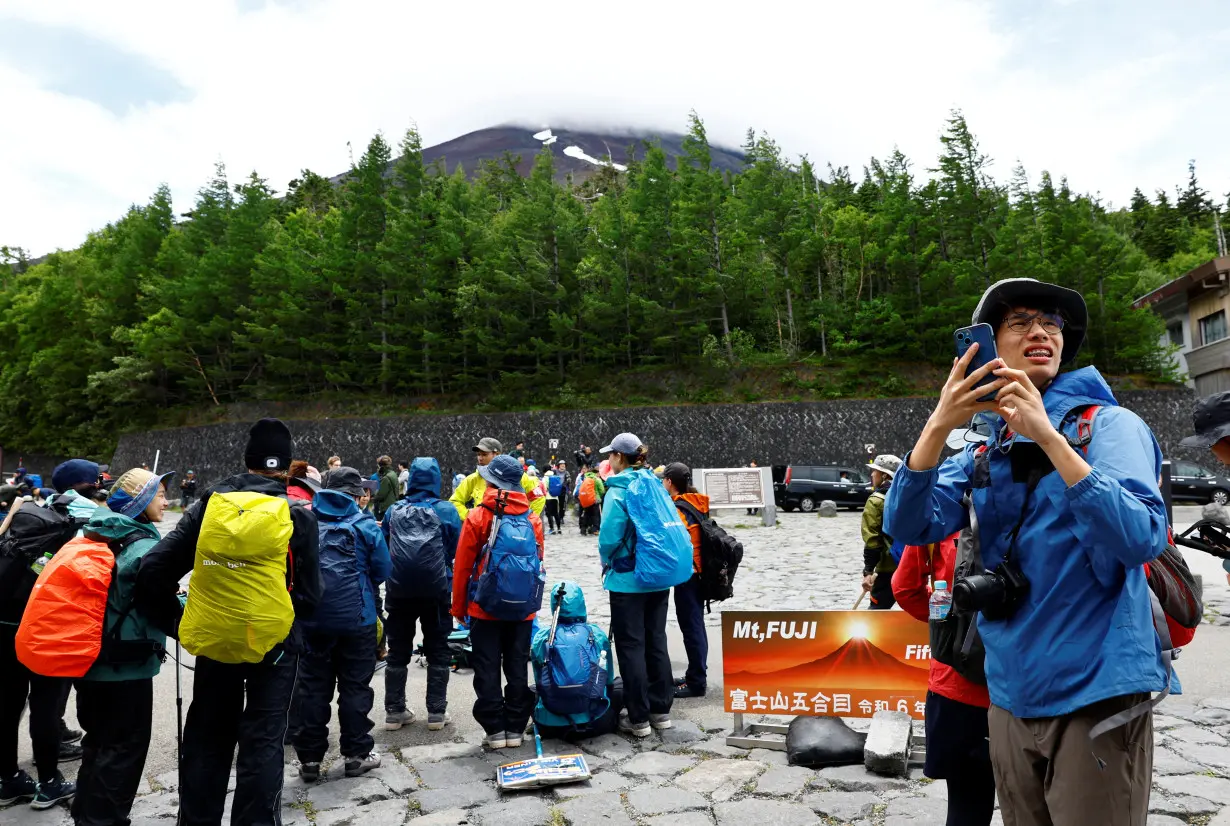 Mount Fuji climbing season starts with new entrance fee as a part of series of trial restrictions to curb overtourism in Fujiyoshida, Japan
