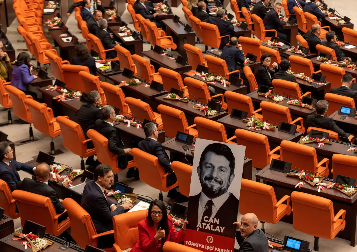 Workers' Party of Turkey MPs display portrait of jailed Atalay in parliament in Ankara