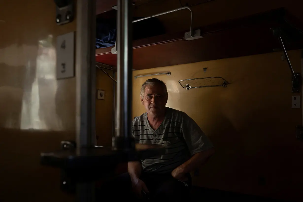 Volodymyr Arkhipov, who fled Russian advances towards his hometown of Toretsk, sits in an evacuation train in Pokrovsk