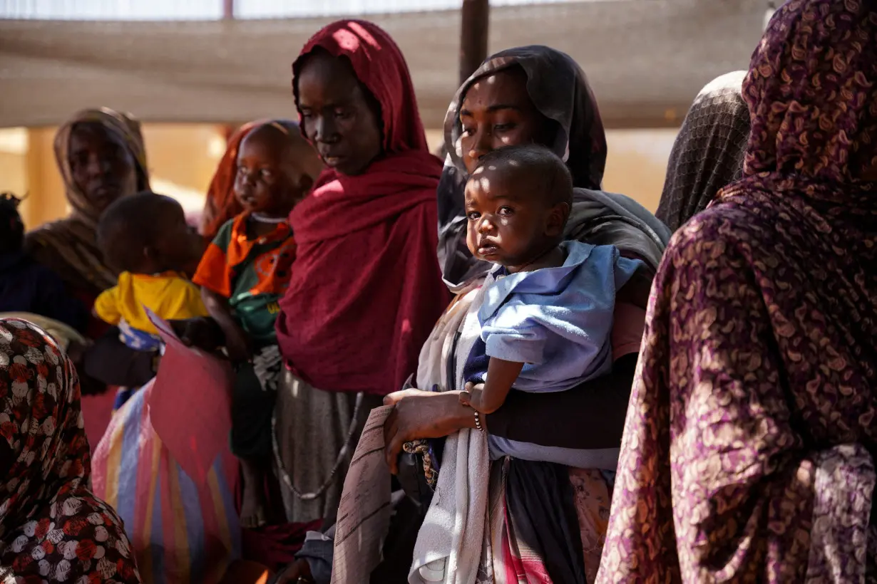 FILE PHOTO: Handout photograph of a woman and baby at the Zamzam displacement camp in North Darfur