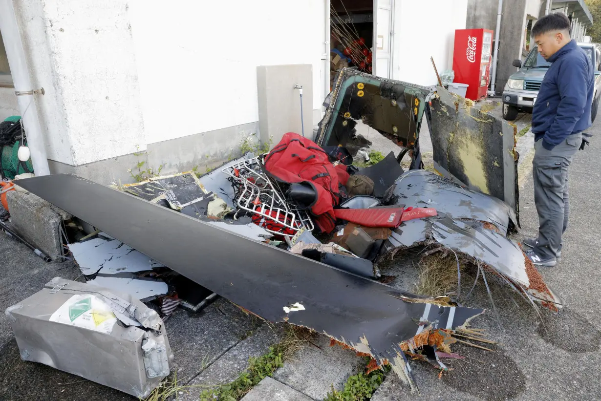 Wreckage believed to belong to the U.S. military aircraft V-22 Osprey that crashed into the sea is collected at Anbo port at Yakushima Island