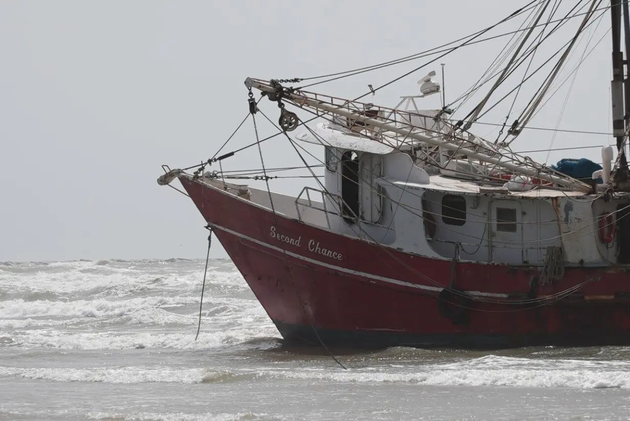 Three adults, two dogs rescued from beached shrimp boat in Port Aransas