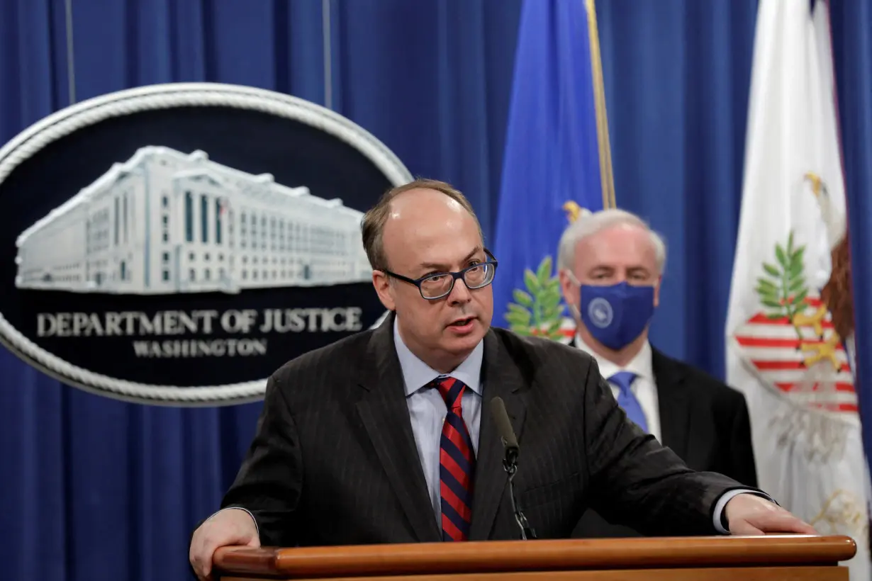 FILE PHOTO: cting Assistant U.S. Attorney General Jeffrey Clark speaks next to Deputy U.S. Attorney General Jeffrey Rosen at a news conference at the Justice Department in Washington