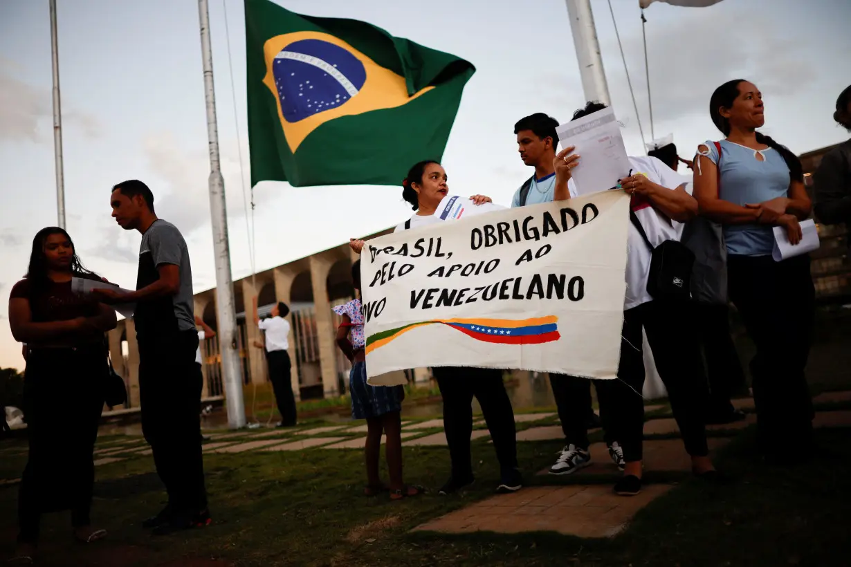 Venezuelan citizens take part in a protest against the electoral results that awarded Venezuela's President Nicolas Maduro, in Brasilia