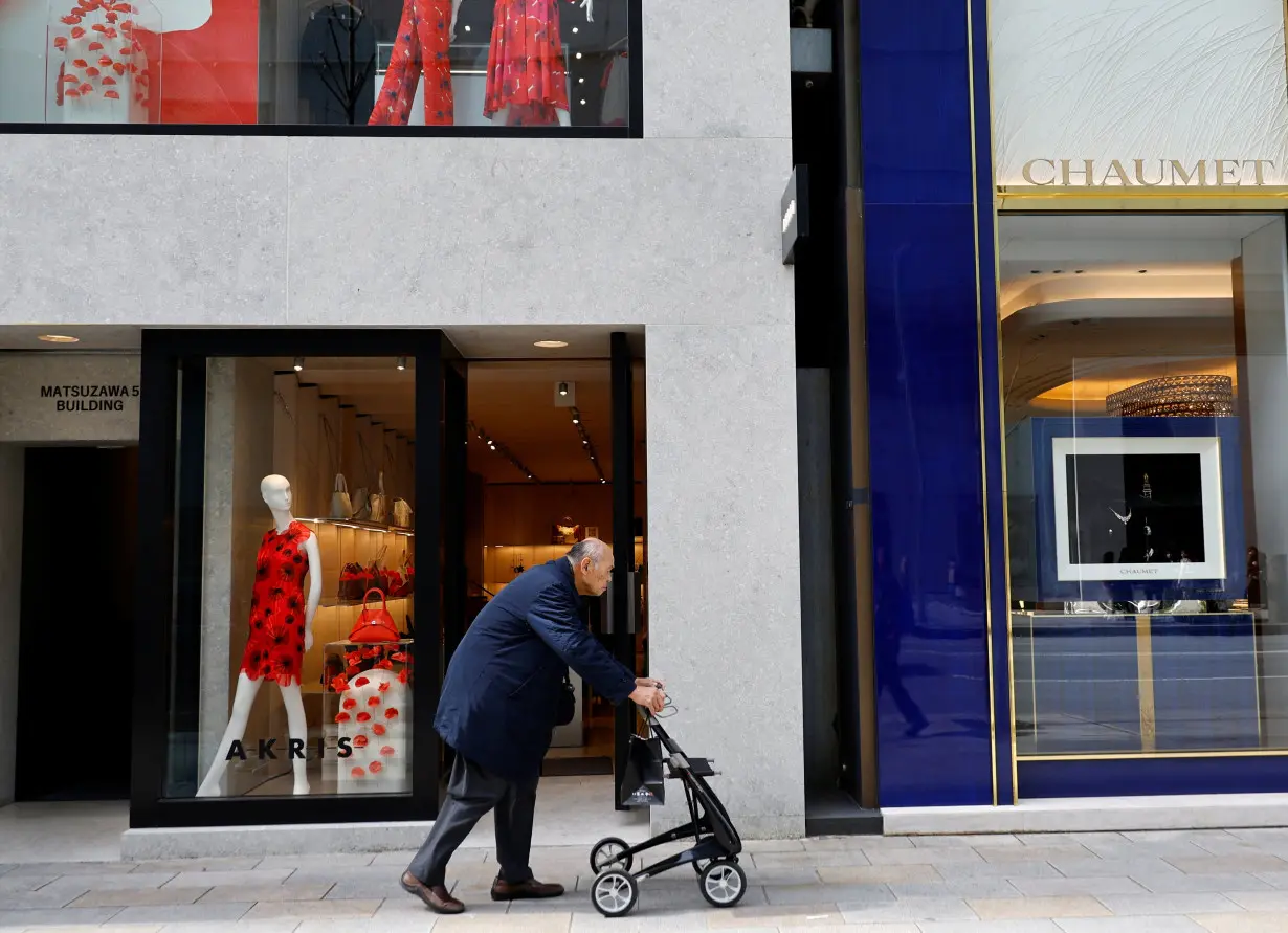 A man makes his way at a shopping district in Tokyo