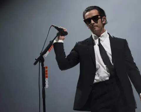 The 1975 is being sued after Matty Healy's kiss of a bandmate shut down a music festival in Malaysia
