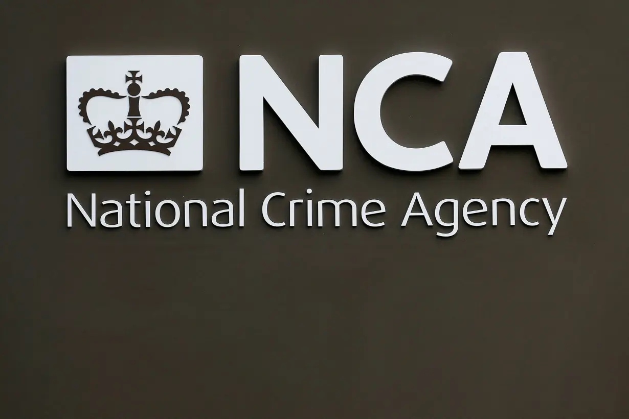 FILE PHOTO: A sign is seen outside the National Crime Agency headquarters in London