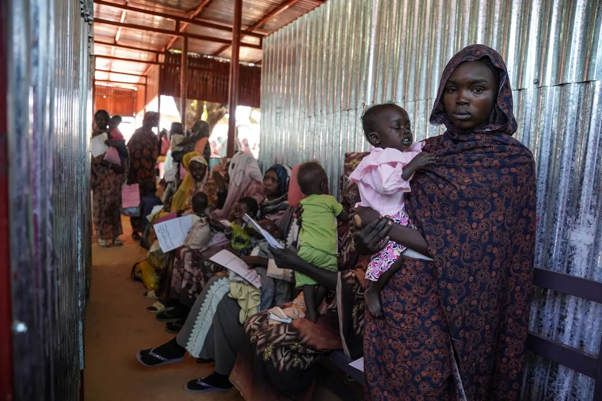 Women and children wait at the Zamzam displacement camp in North Darfur, Sudan, in January.