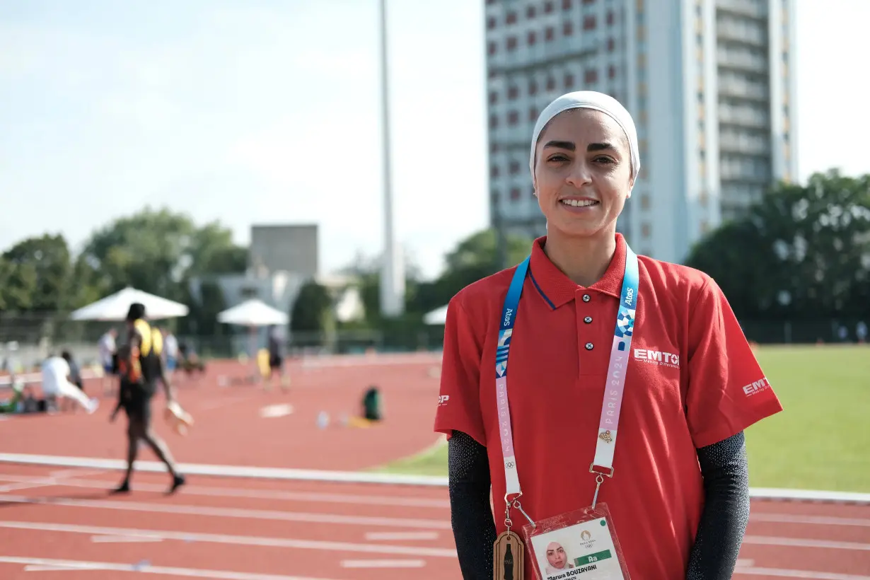 Tunisian steeplechase runner Marwa Bouzayani stands on the side of the athletics training track for the summer Olympics in Ile-Saint-Denis