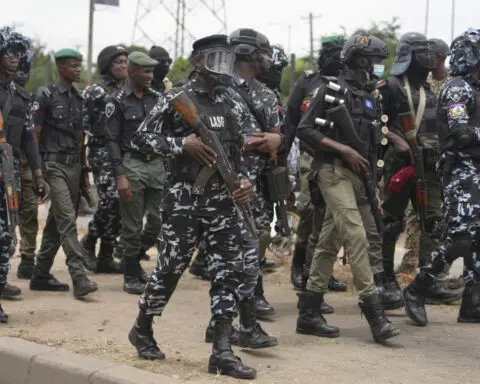 Rights group says security forces have killed 9 as Nigeria protests over hardship enter a second day
