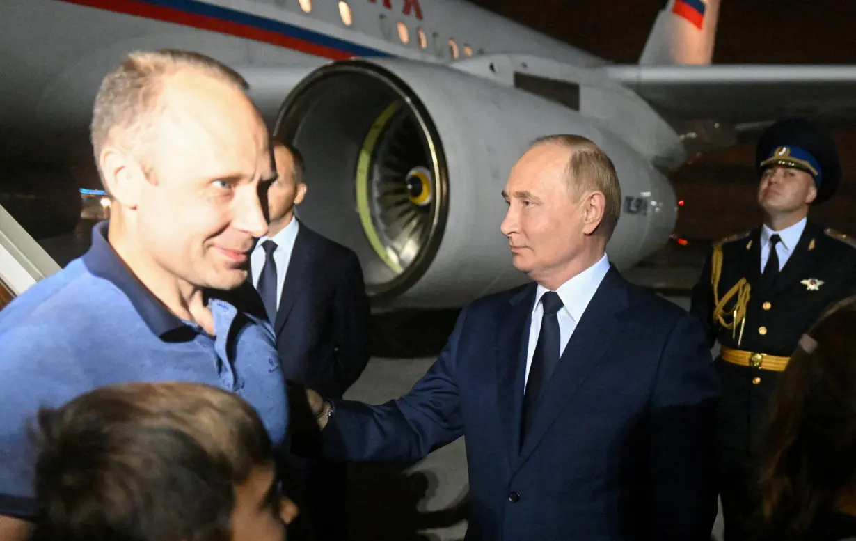 FILE PHOTO: President Putin greets Russians returning to Moscow after prisoner swap