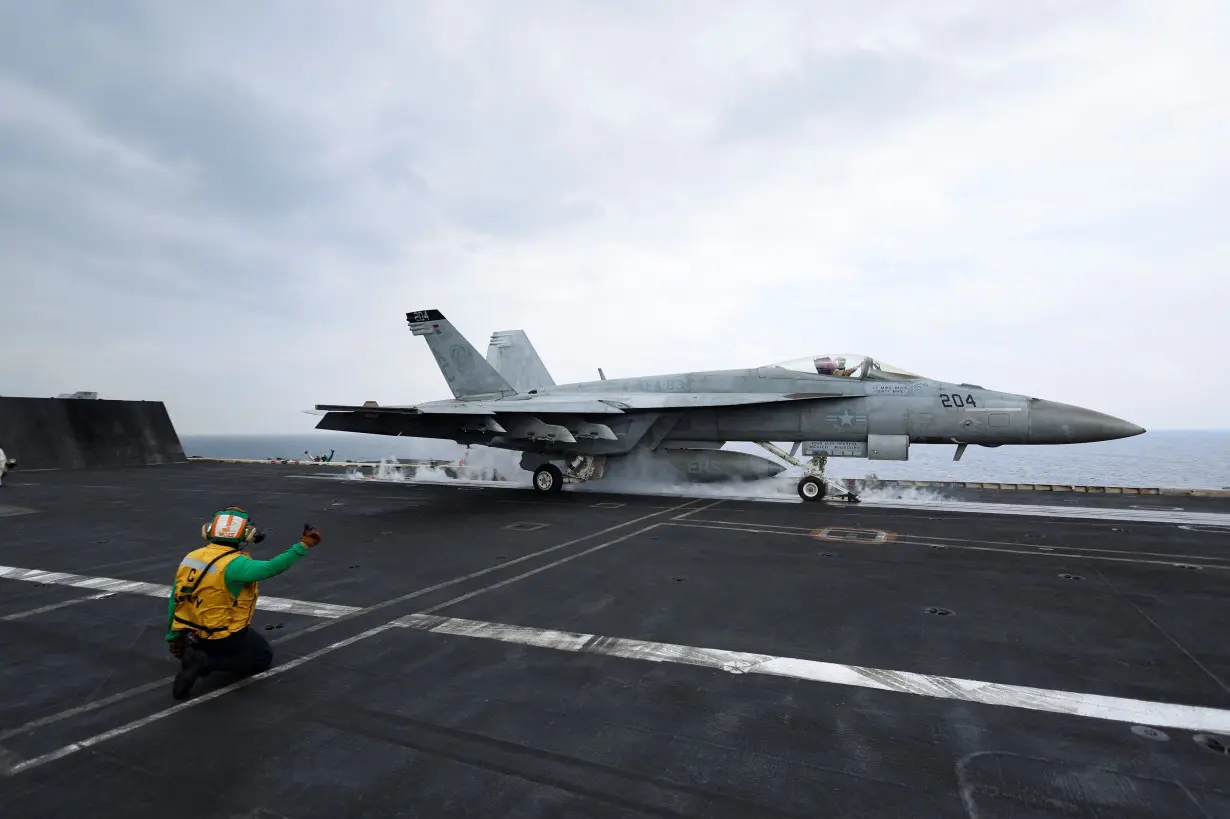 A F/A-18E Super Hornet fighter jet is catapulted off the flight deck of the USS Dwight D. Eisenhower (CVN 69) aircraft carrier in Southern Red Sea, Middle East