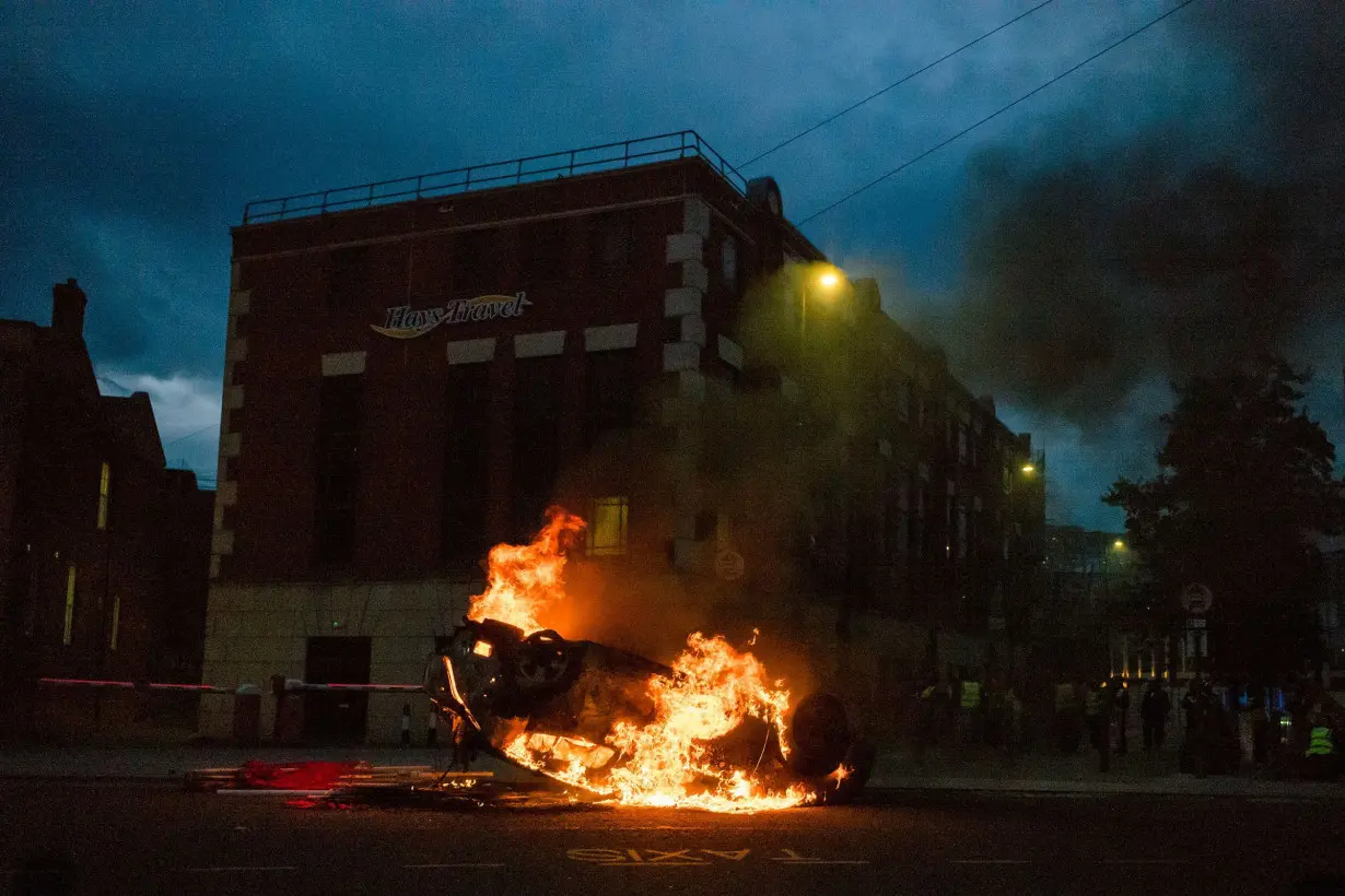 A police car is set on fire in Sunderland, England on August 2.