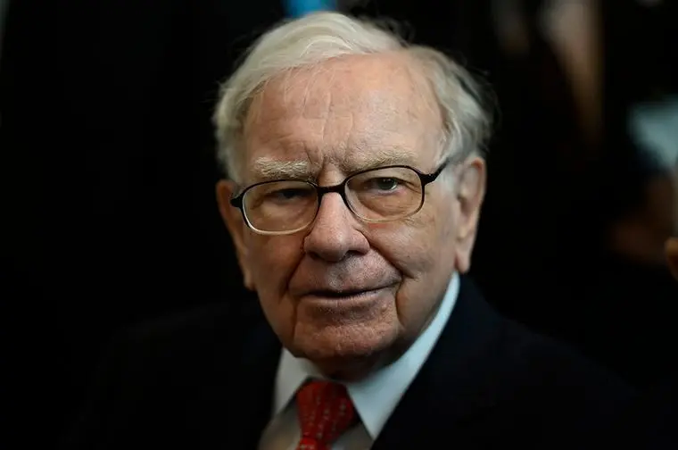 Warren Buffett's Berkshire Hathaway cuts stake in Apple by nearly 50%