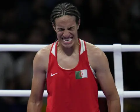 Algerian boxer Imane Khelif clinches medal at Olympics after outcry fueled by gender misconceptions