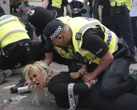 Police officers injured as far-right activists face off against anti-racism groups across UK