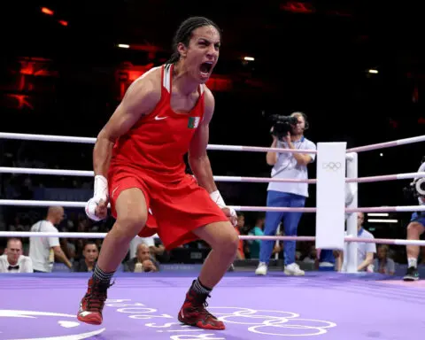 Algerian boxer Imane Khelif wins quarterfinal bout and guarantees herself an Olympic medal