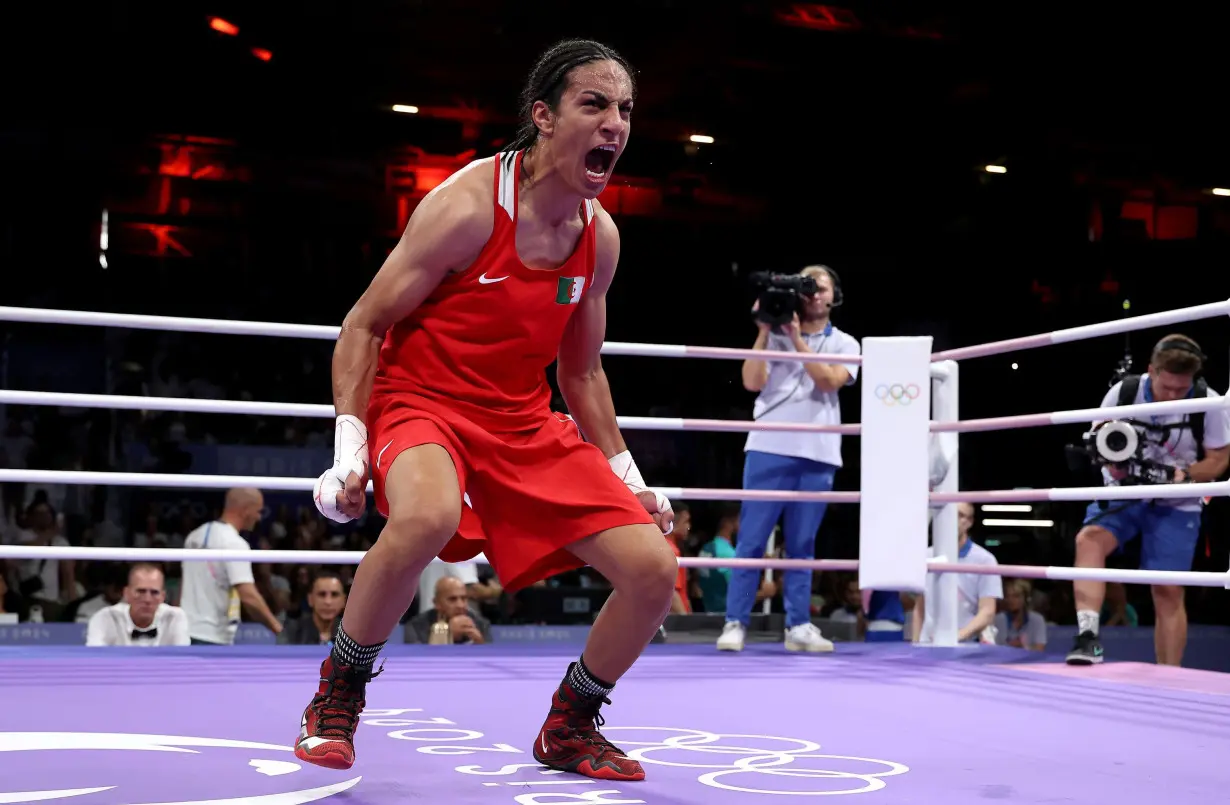 Algerian boxer Imane Khelif wins quarterfinal bout and guarantees herself an Olympic medal