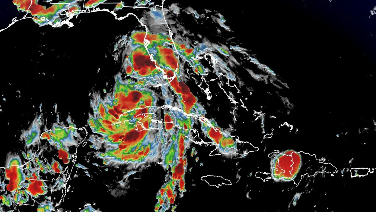 Warm Gulf waters could help slow-moving Tropical Storm Debby strengthen to a Category 1 hurricane before landfall