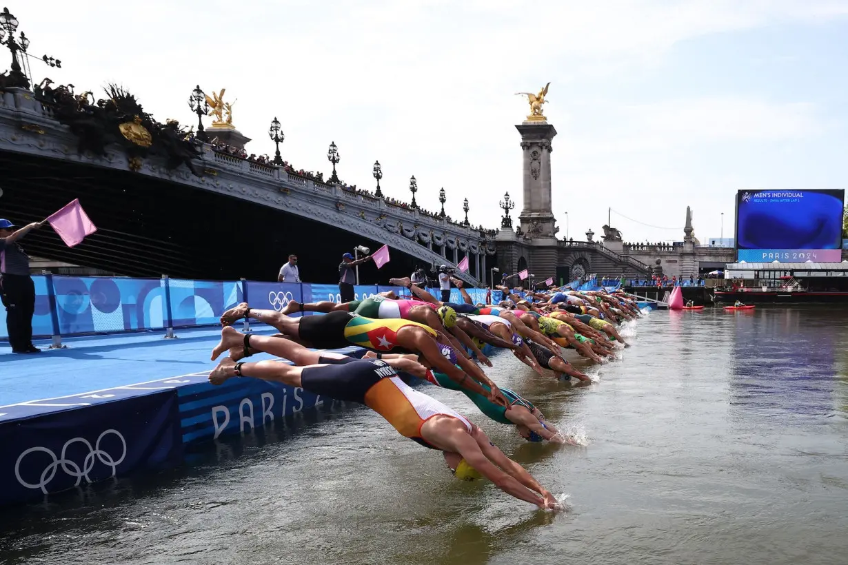 Belgium withdraws from mixed relay triathlon after triathlete falls ill days after swimming in the Seine