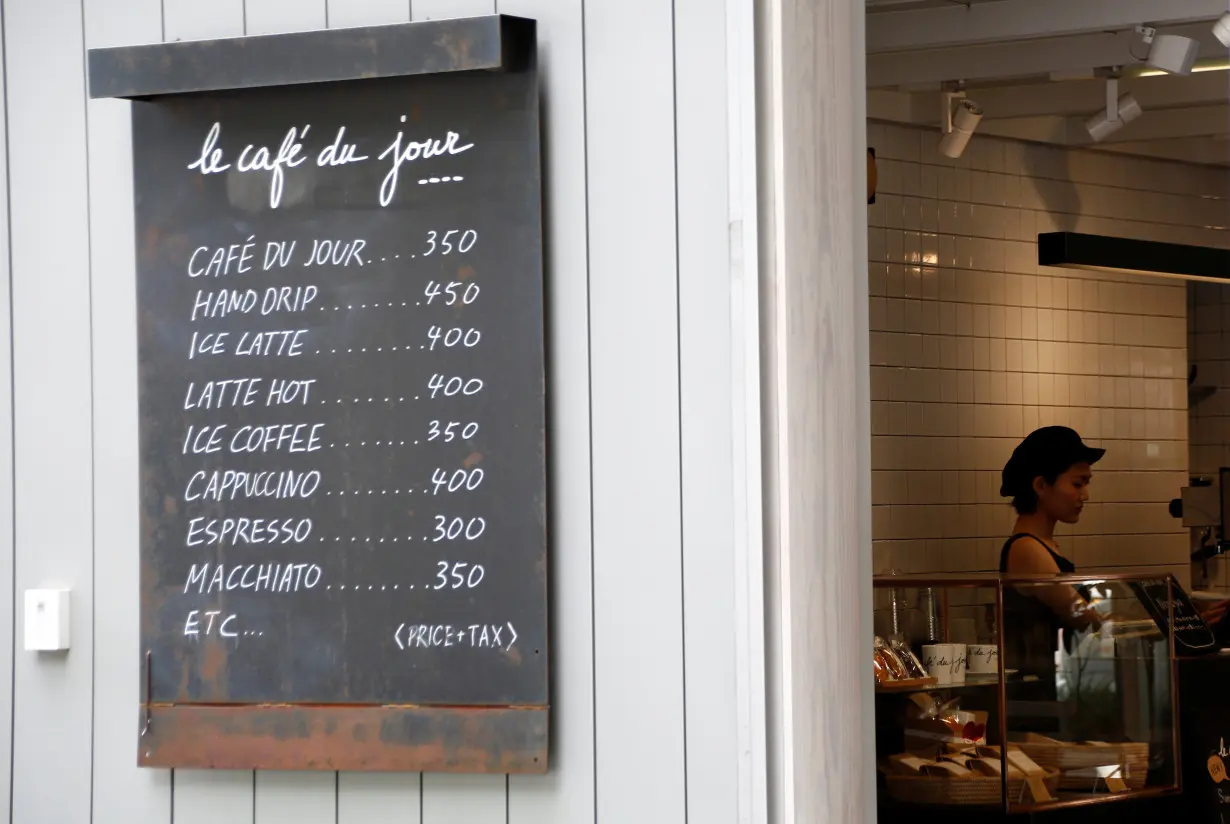 A woman works at a coffee shop in Tokyo