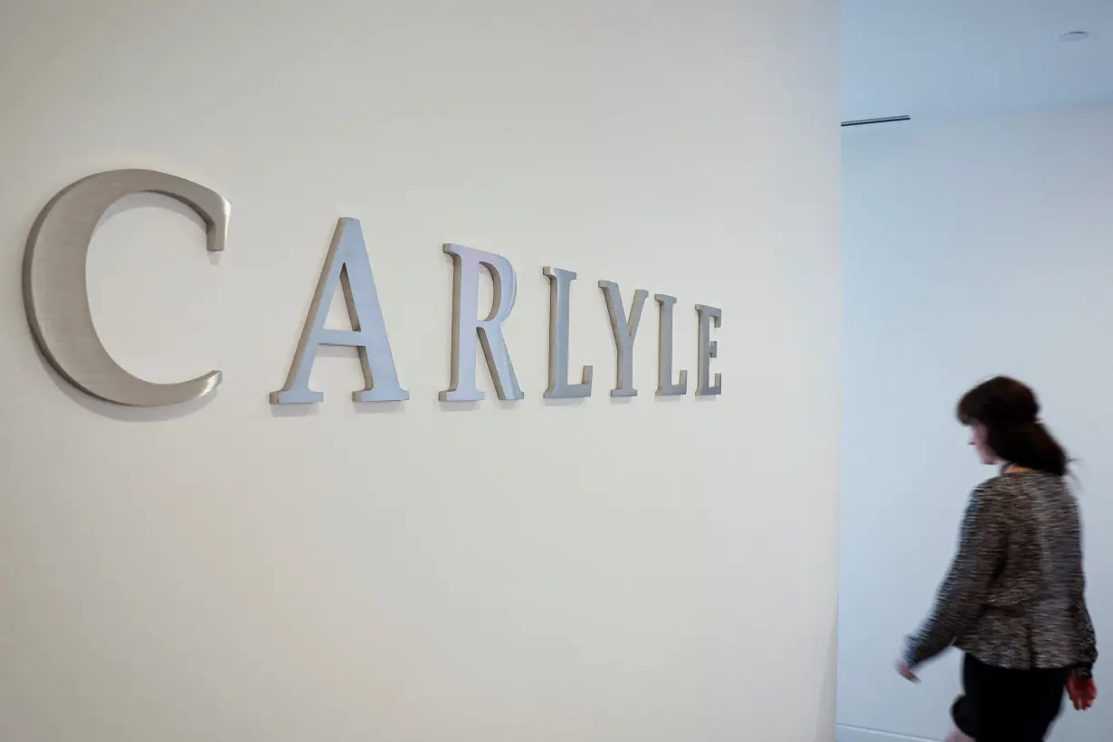 The logo for Carlyle is seen at the company's offices in New York