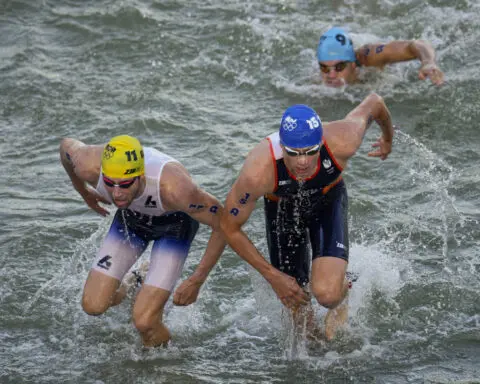 After water quality concerns canceled test runs, Olympic triathletes plunge into the Seine for relay