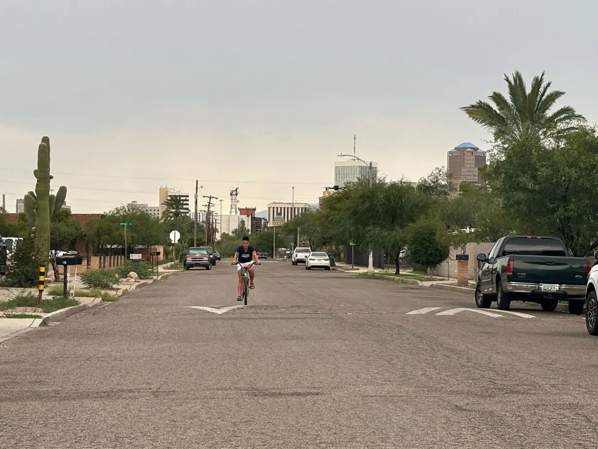 Arizona voter Melissa Cordero rides her bike in Tucson.