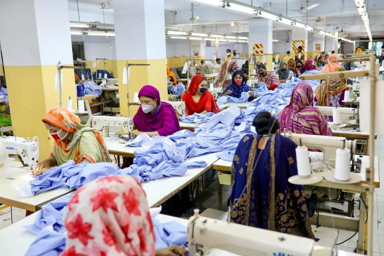 Women work in a garment factory, as factories reopened after the government has eased the restrictions amid concerns over the coronavirus disease (COVID-19) outbreak in Dhaka