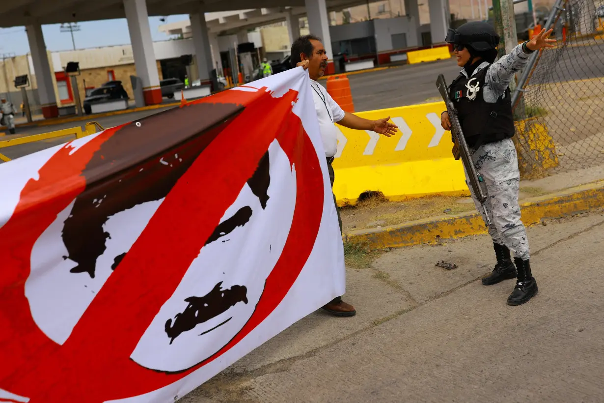 People take part in a protest against election results, in Ciudad Juarez