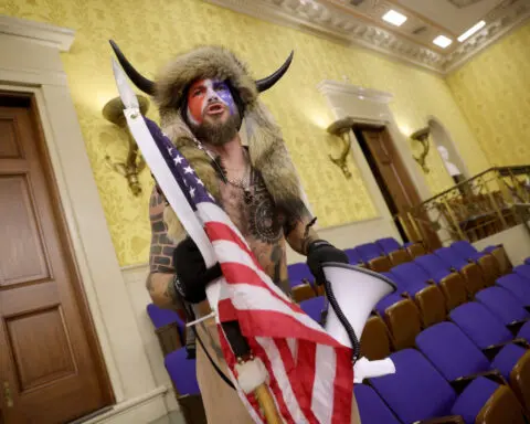 January 6 rioter ‘QAnon Shaman’ to get his headdress and spear back, judge rules