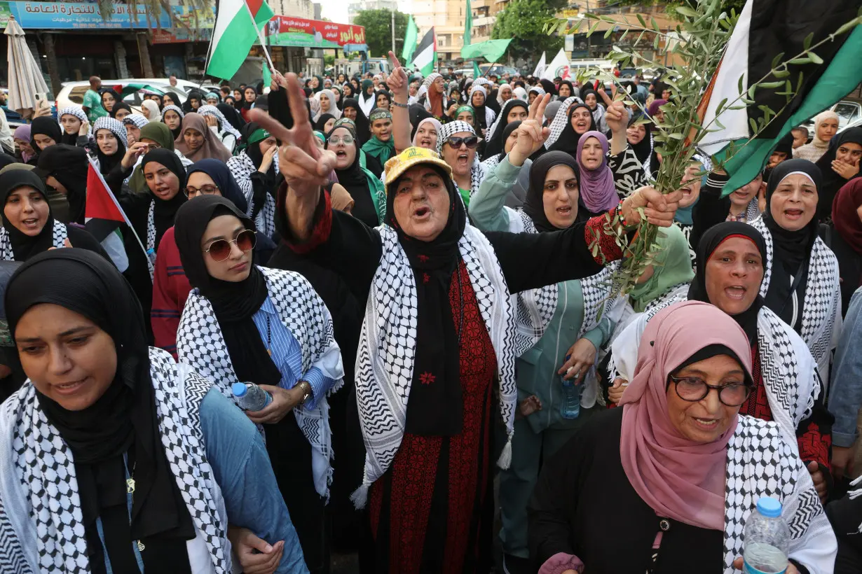 A demonstrator gestures during a protest condemning the killing of Hamas chief Ismail Haniyeh, in Sidon