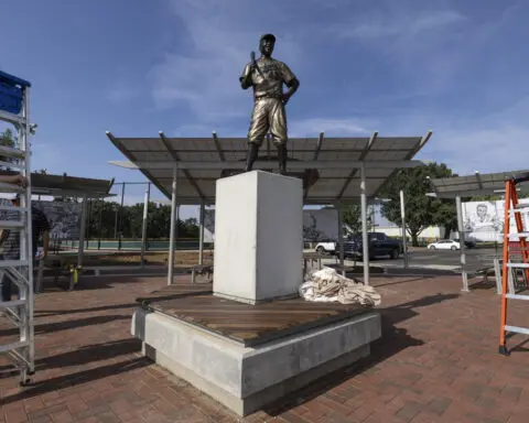 A rebuilt bronze Jackie Robinson statue returns to Kansas 6 months after the original was stolen