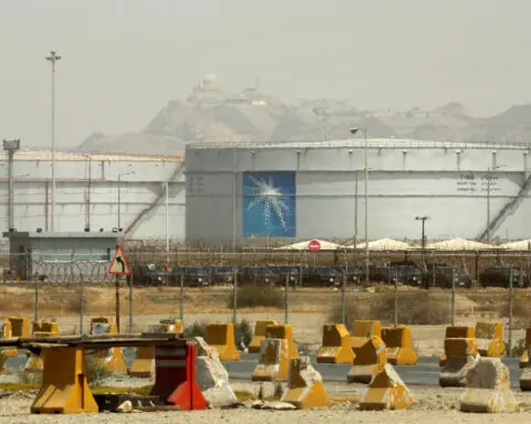 Saudi Arabia's Aramco reports lower half-year profits as economic worries dampen energy prices