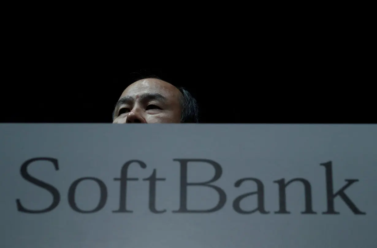 FILE PHOTO: Japan's SoftBank Group Corp Chief Executive Masayoshi Son attends a news conference in Tokyo