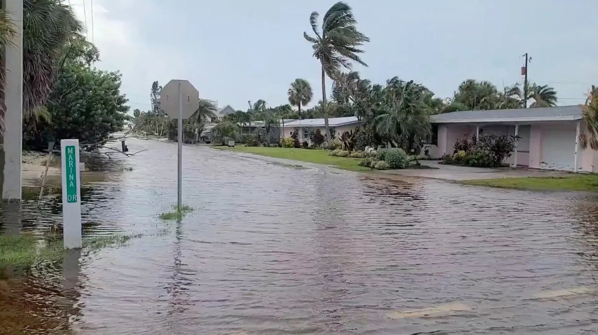 A view of a flooded street due to storm Debby in Holmes Beach, Florida