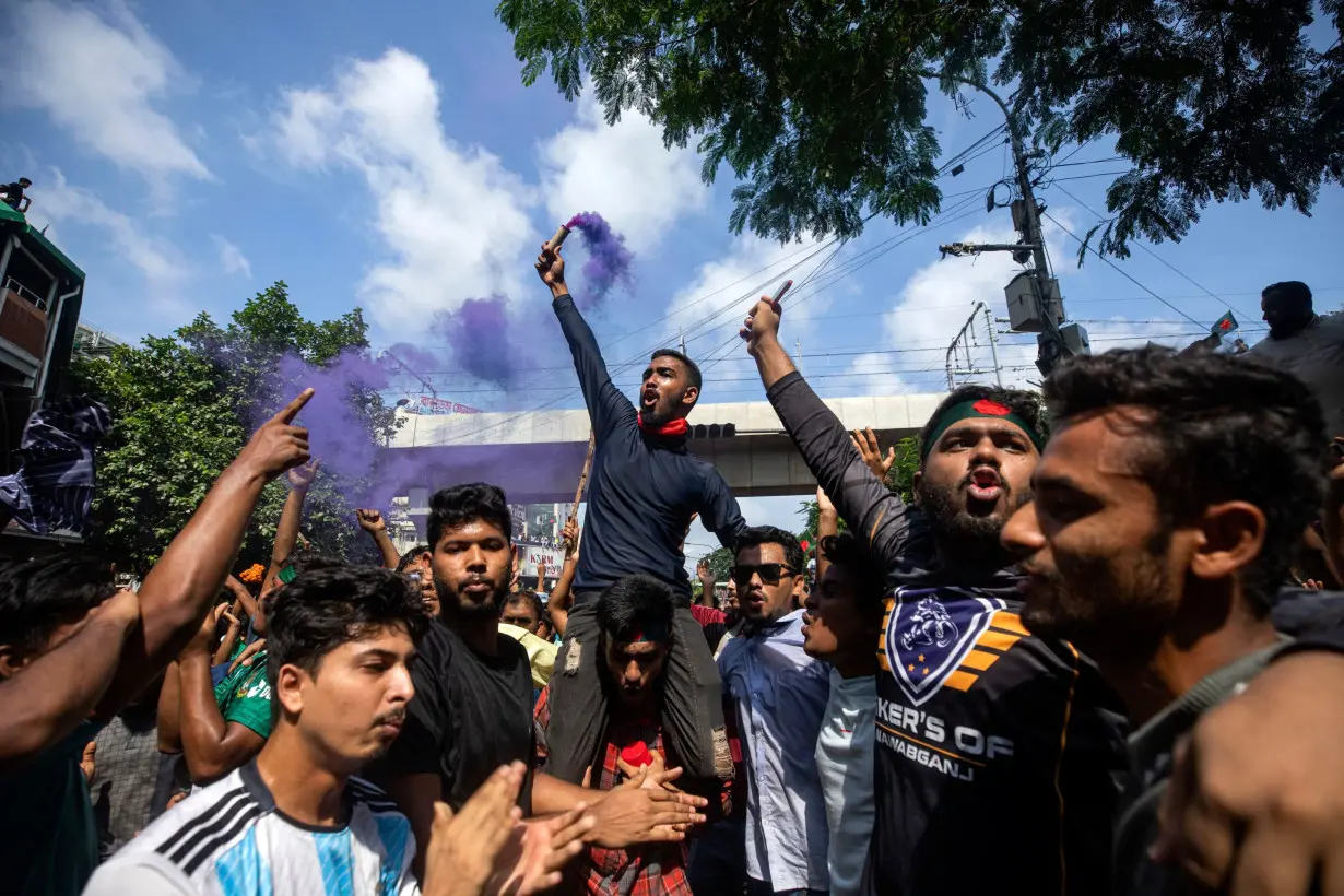 Protesters shout slogans as they celebrate Prime Minister Sheikh Hasina's resignation in Dhaka.