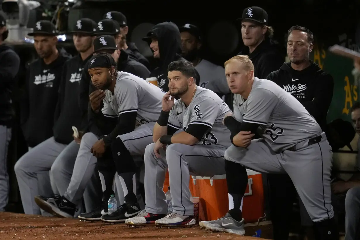 Chicago White Sox players react from the dugout during the eighth inning of the game against the Oakland Athletics.