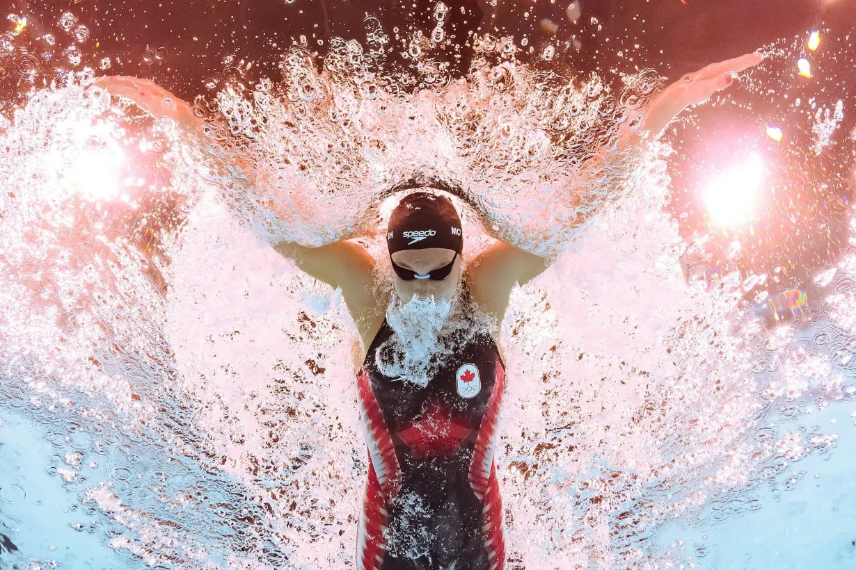 An underwater view shows Canada's Summer McIntosh competing in the heats of women's 400m individual medley swimming event during the Paris 2024 Olympic Games at the Paris La Defense Arena in Nanterre, west of Paris, on July 29.