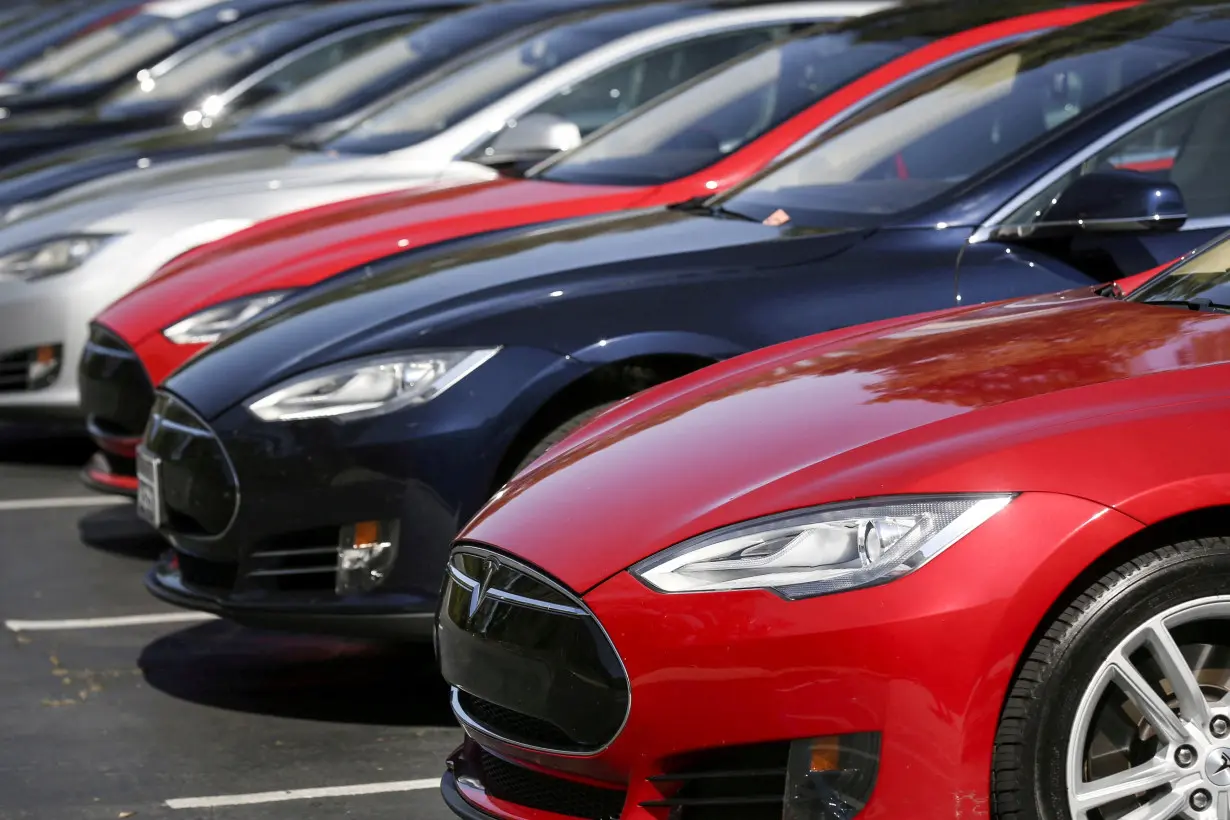 FILE PHOTO: Row of Tesla Model S sedans are seen outside the company's headquarters in Palo Alto, California