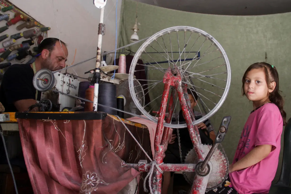 Gazan tailor turns to bicycle to power sewing machine