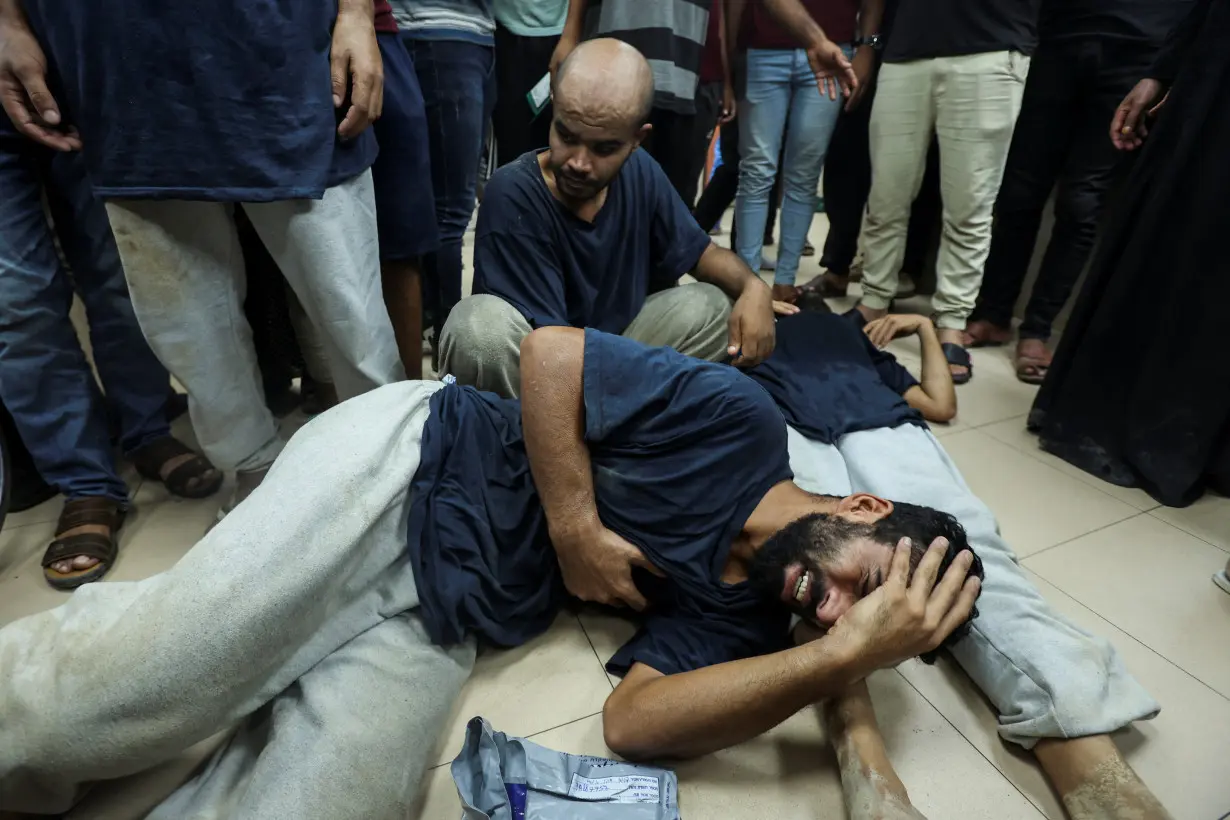 Palestinians who were detained by Israel arrive at Al-Aqsa Martyrs Hospital following their release, in Deir Al-Balah in the central Gaza Strip