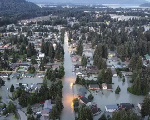 Picturesque glacier releases water down a river in Alaska. More than 100 homes are damaged