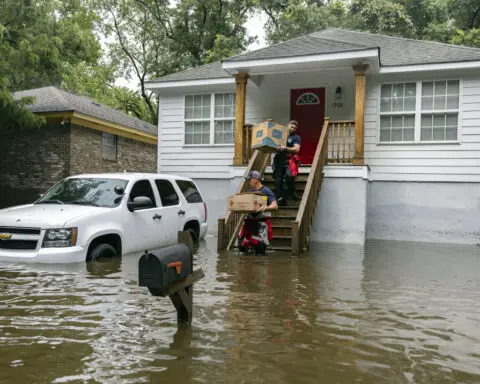 The Latest: Tropical Storm Debby churns off the US Southeast