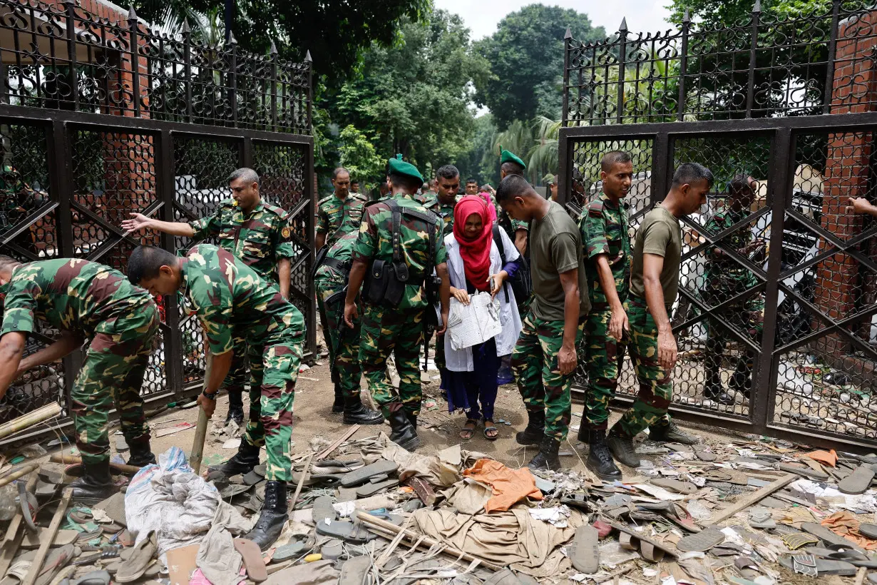 FILE PHOTO: Army members clear an entrance of the Ganabhaban after Bangladeshi PM Hasina's resignation, in Dhaka