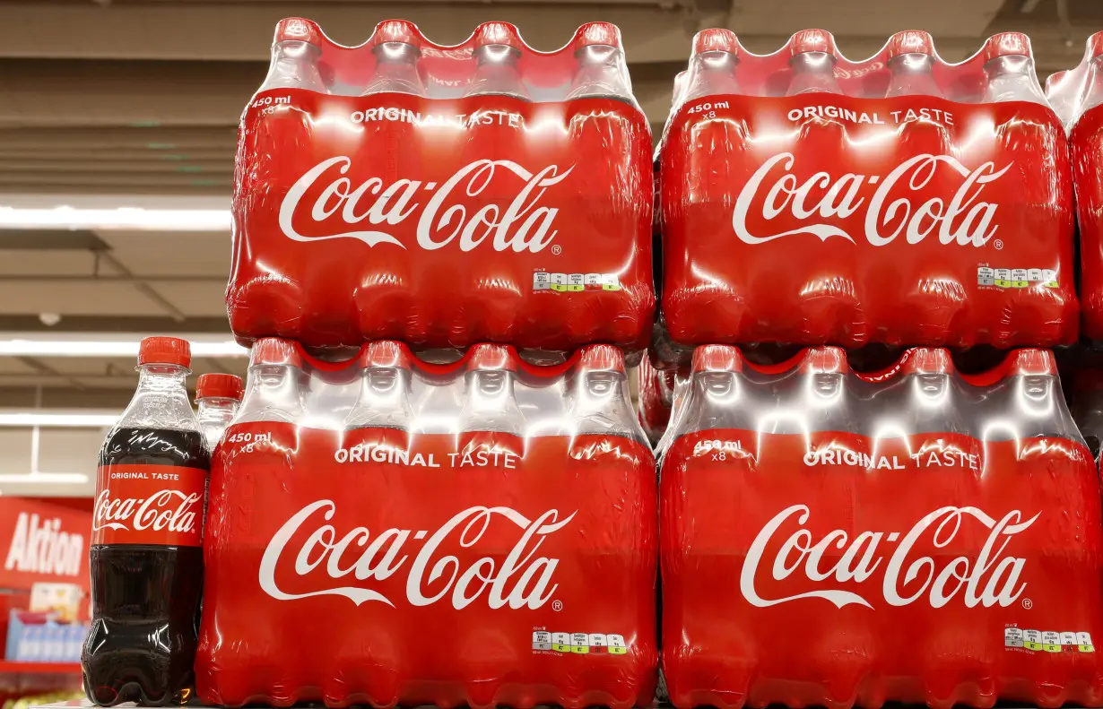 FILE PHOTO: Bottles of Coca-Cola are displayed at a supermarket of Swiss retailer Denne in Glattbrugg