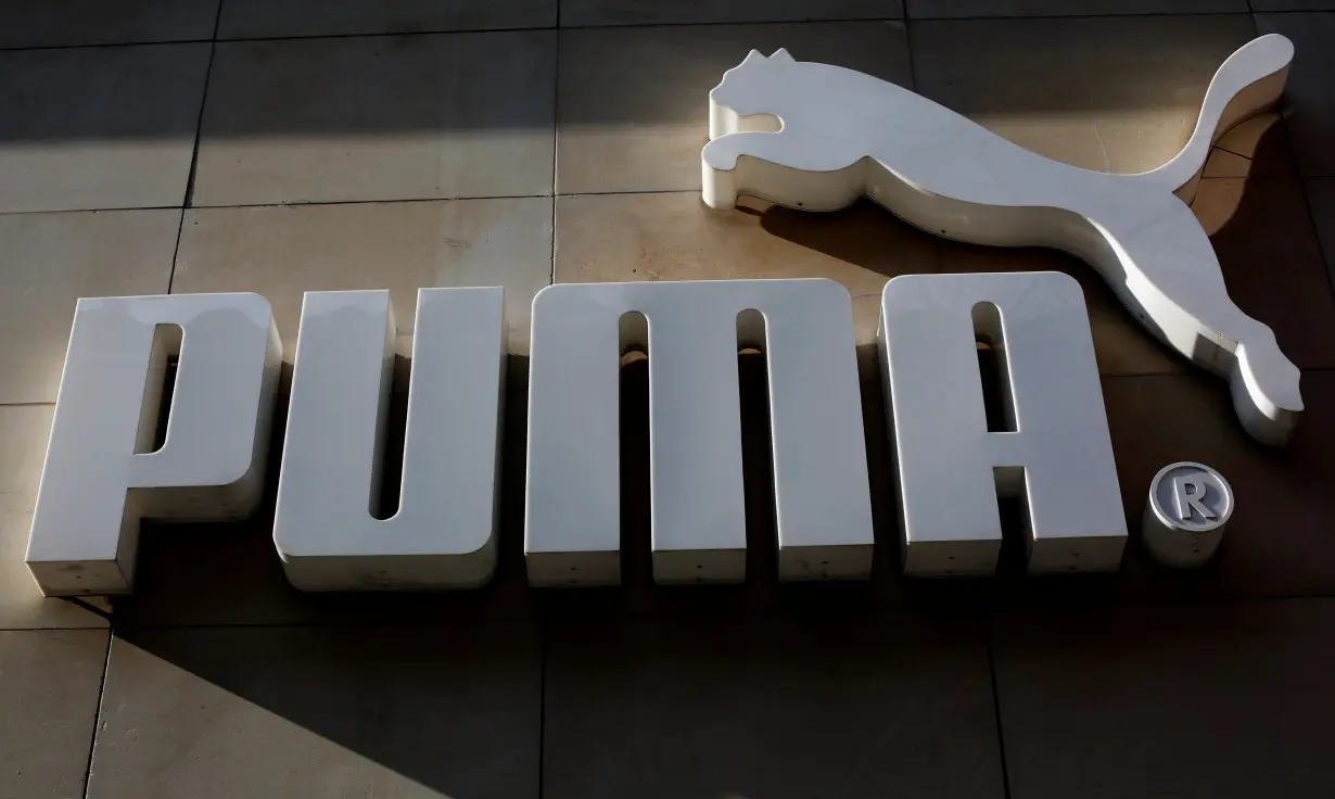 The logo of German sports goods firm Puma is seen at the entrance of one of its stores in Vienna