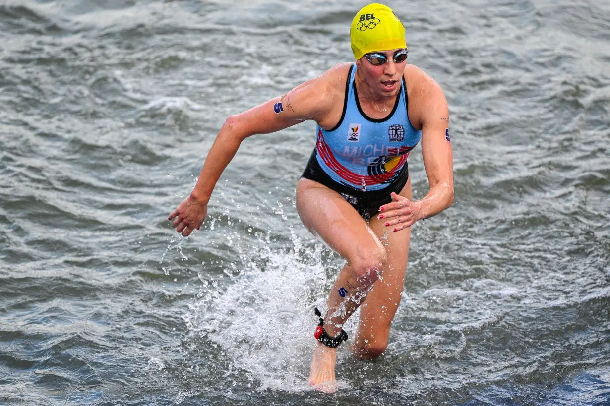 Belgian triathlete who fell ill after Seine race says she did not contract E. coli